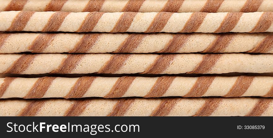 Background of waffle rolls. Close up. Horizontal.