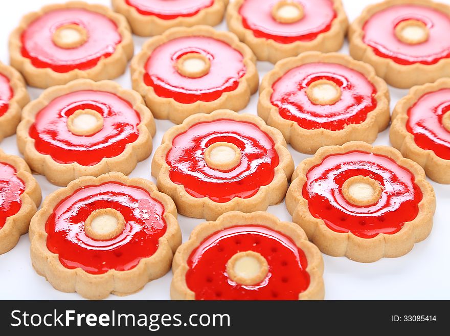 Lot of strawberry biscuits. Cllose up. White background.