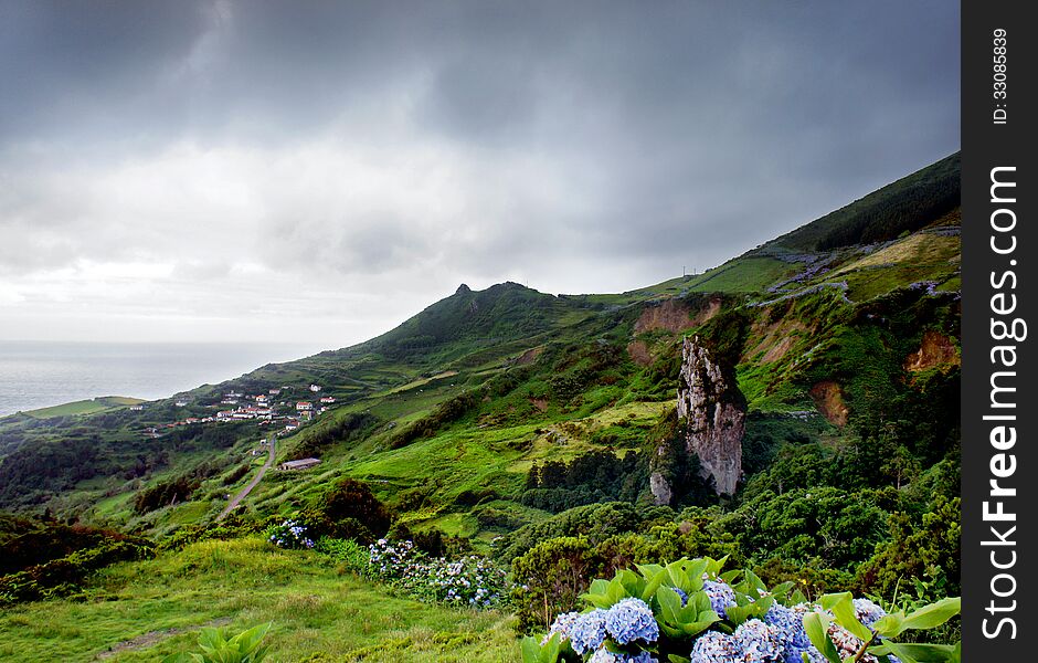A shot of a incoming storm over a coast in the Flores island, in the Azores archipelago. A shot of a incoming storm over a coast in the Flores island, in the Azores archipelago.