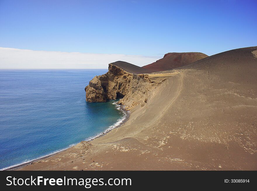 A shot of the coast near Capelinhos volcano in Faial Island, Azores archipelago: the volcano was born in the 50s. A shot of the coast near Capelinhos volcano in Faial Island, Azores archipelago: the volcano was born in the 50s