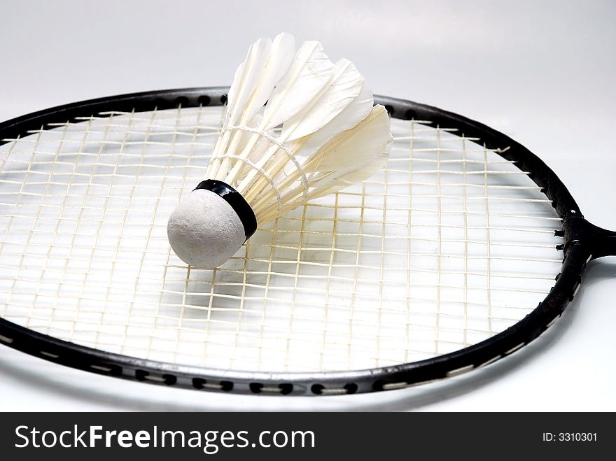 Focus a shuttlecocks image on the badminton racket
