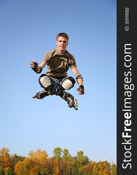 Jumping roller against clear sky