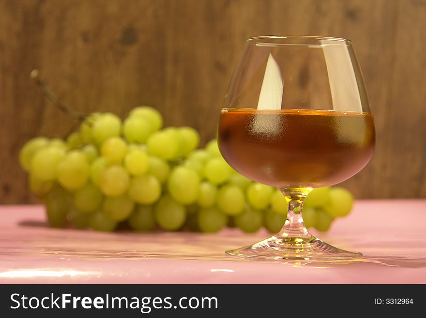 Grape juice on a background of grapes
