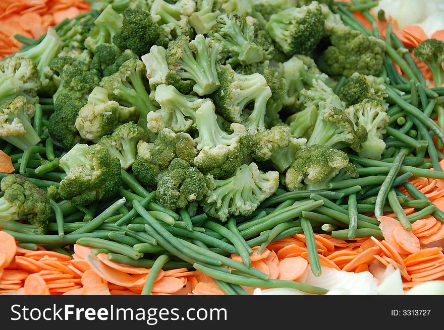 Fresh and healthy broccoli decorated with french bean and carrot. Fresh and healthy broccoli decorated with french bean and carrot.