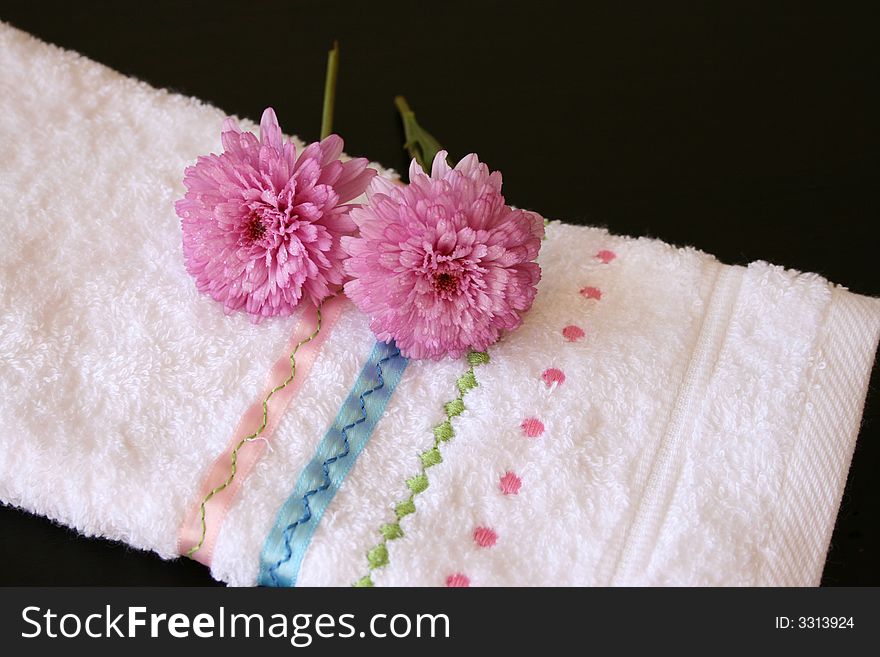 Embroided hand towel with plush pink flowers. Embroided hand towel with plush pink flowers