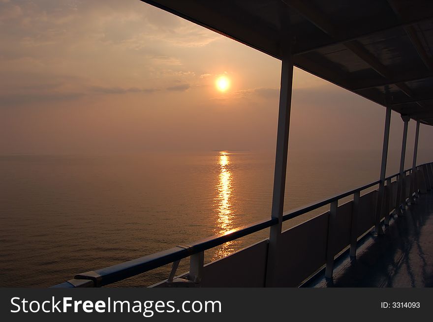 Sea sunset, view at the ship deck. Sea sunset, view at the ship deck