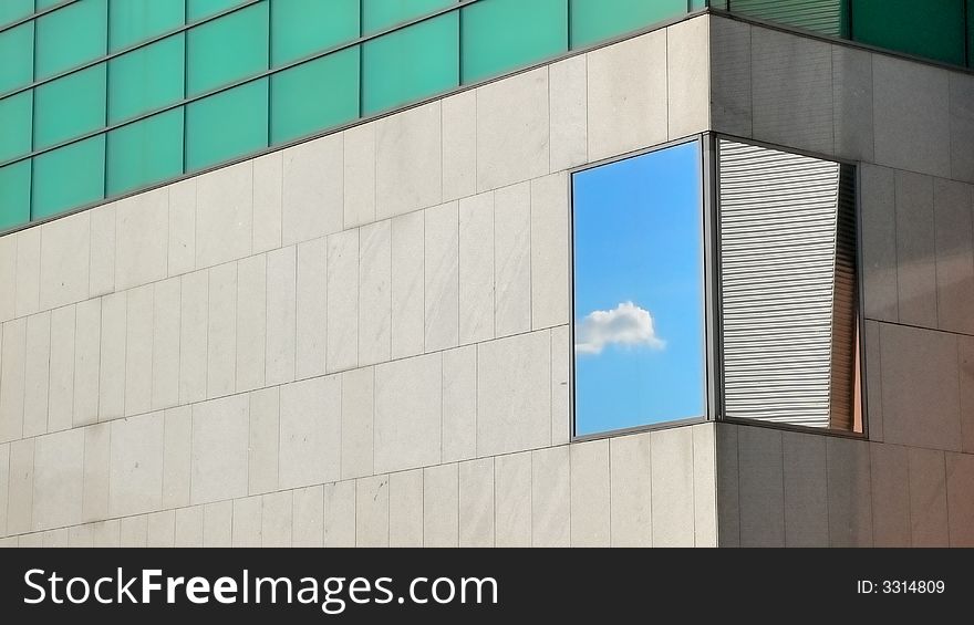 Reflection of a cloud in the sky in the facade of a building at the Landhaus in Sankt Poelten. Reflection of a cloud in the sky in the facade of a building at the Landhaus in Sankt Poelten