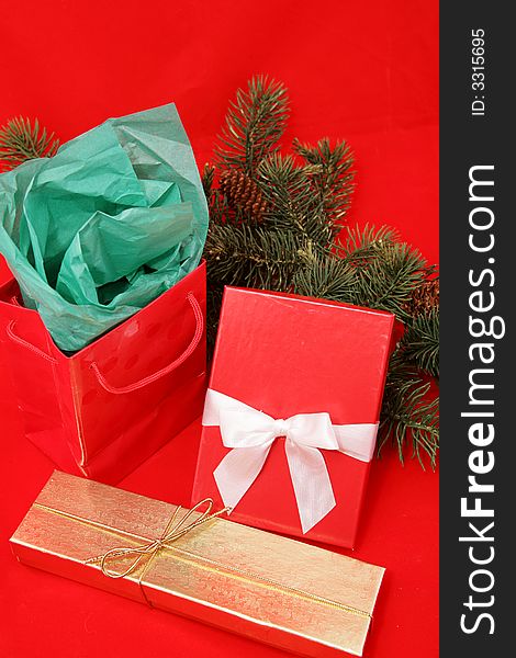 Pretty Christmas gifts on red background.