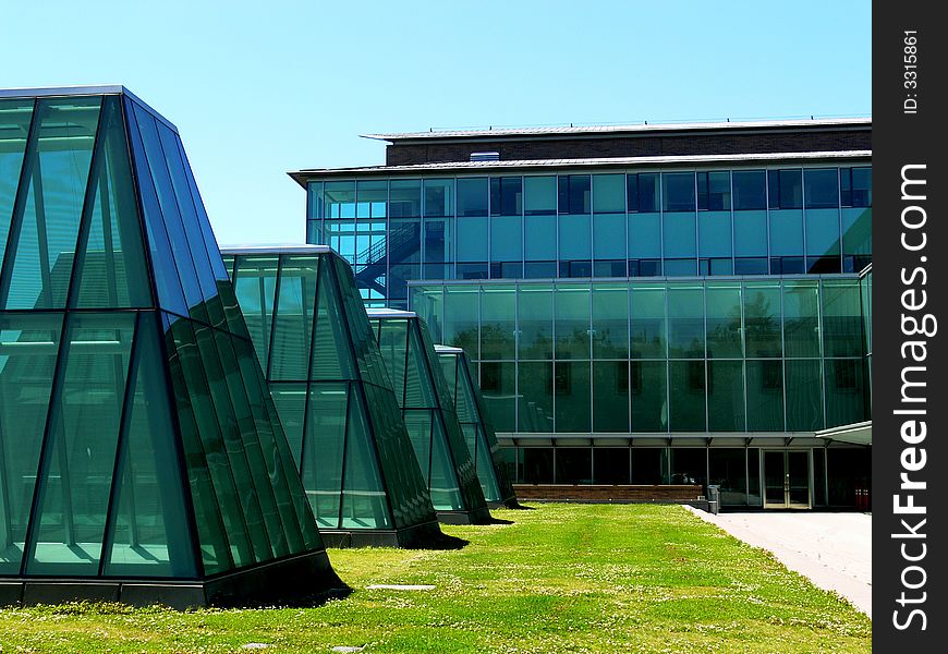 A shot of several glass buildings with lines and angles. A shot of several glass buildings with lines and angles.