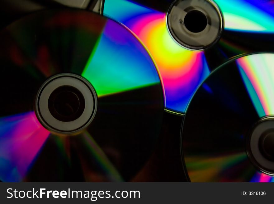 Colour cd disk with rainbowq glow on the black background. Colour cd disk with rainbowq glow on the black background