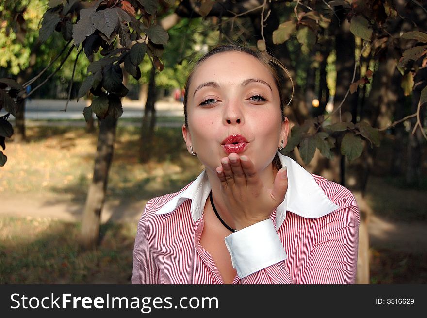 Girl sending a blowing kiss