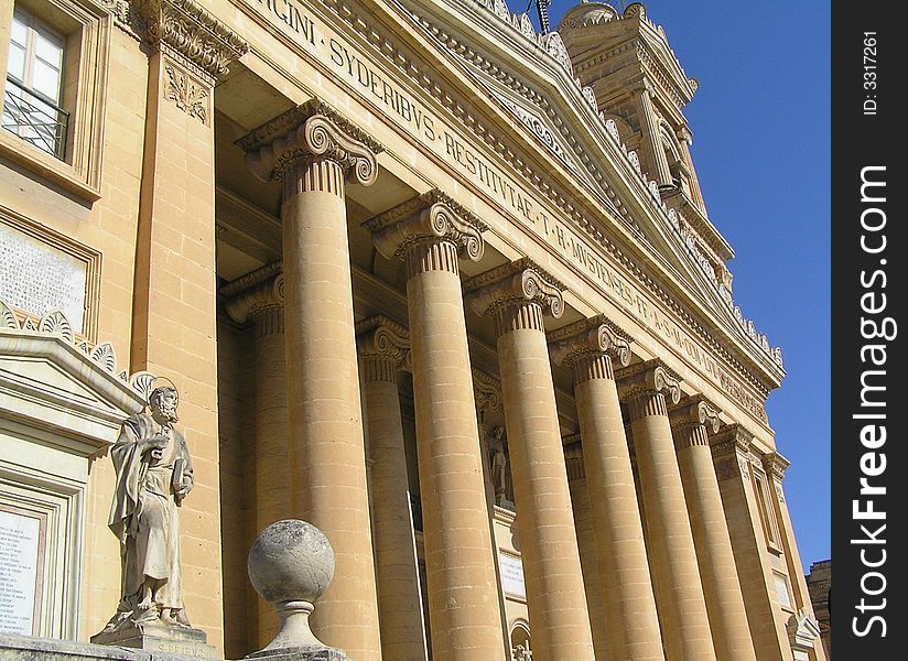With its pillars dominating its entrance, Mosta Dome Cathedral, Malta, is a very imposing building. With its pillars dominating its entrance, Mosta Dome Cathedral, Malta, is a very imposing building.