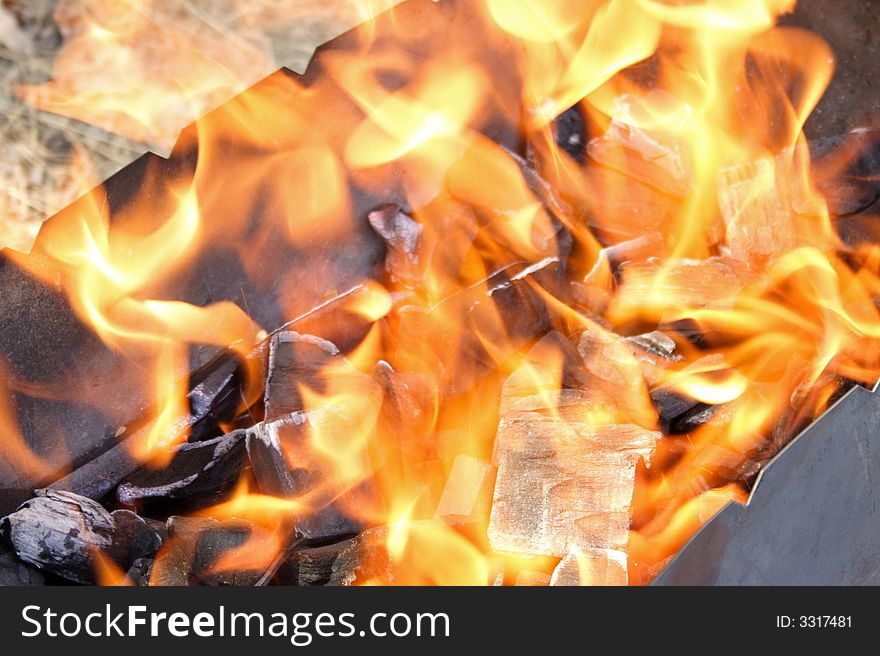Firing of charcoal in fire-place. Firing of charcoal in fire-place
