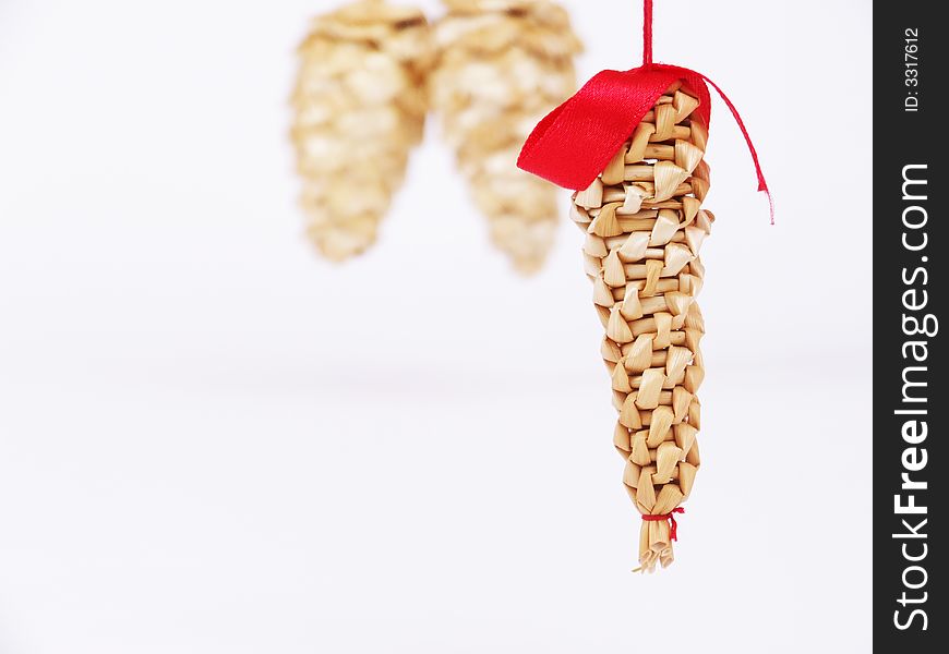 Some hanging cones made of straw. Some hanging cones made of straw