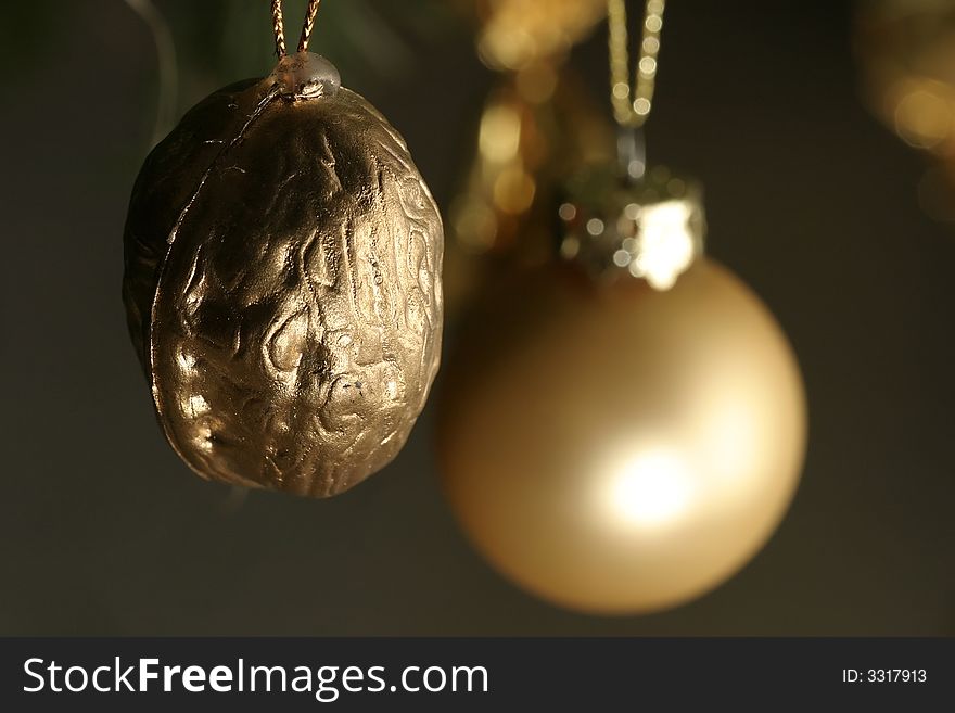Isolated gold walnut christmas decoration. Isolated gold walnut christmas decoration