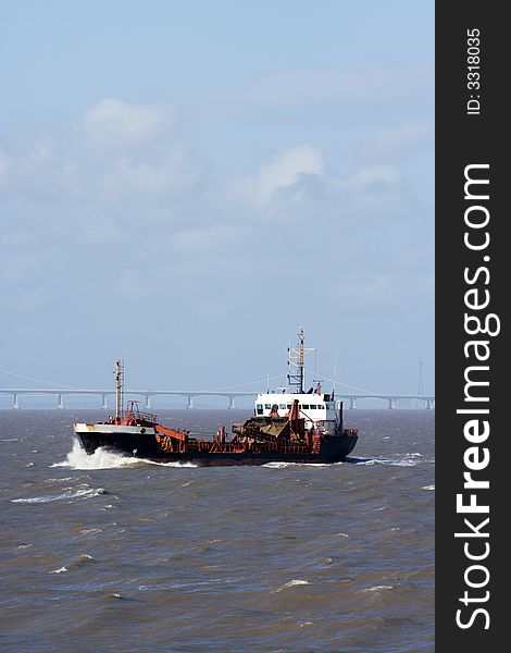 A dredger ploughing through waves in the Bristol Channel. A dredger ploughing through waves in the Bristol Channel