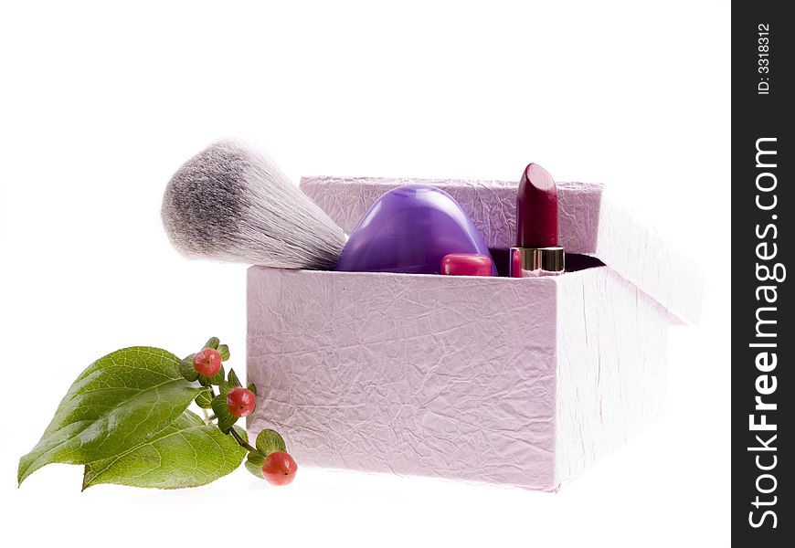 Pink box with cosmetics and toiletries on a white background