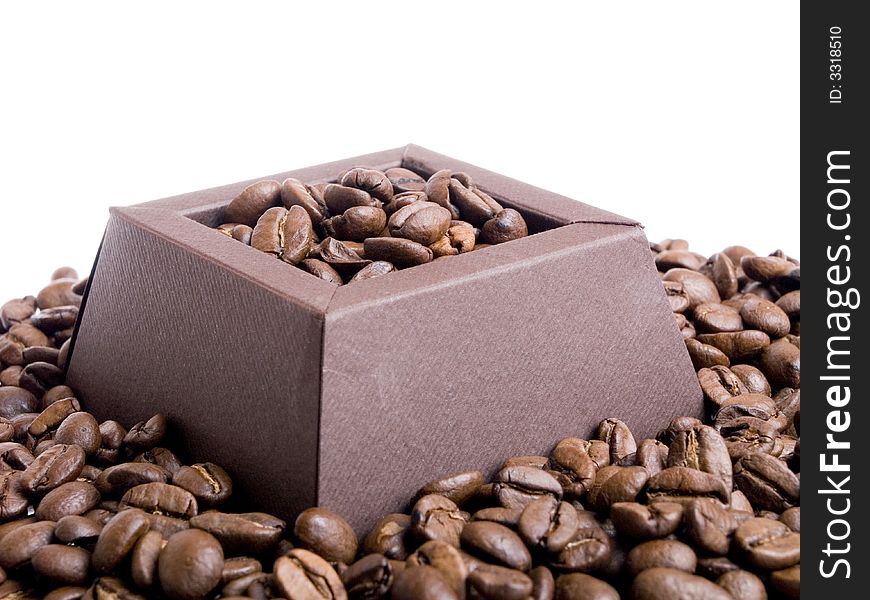 Coffee beans in the brown box on the white background