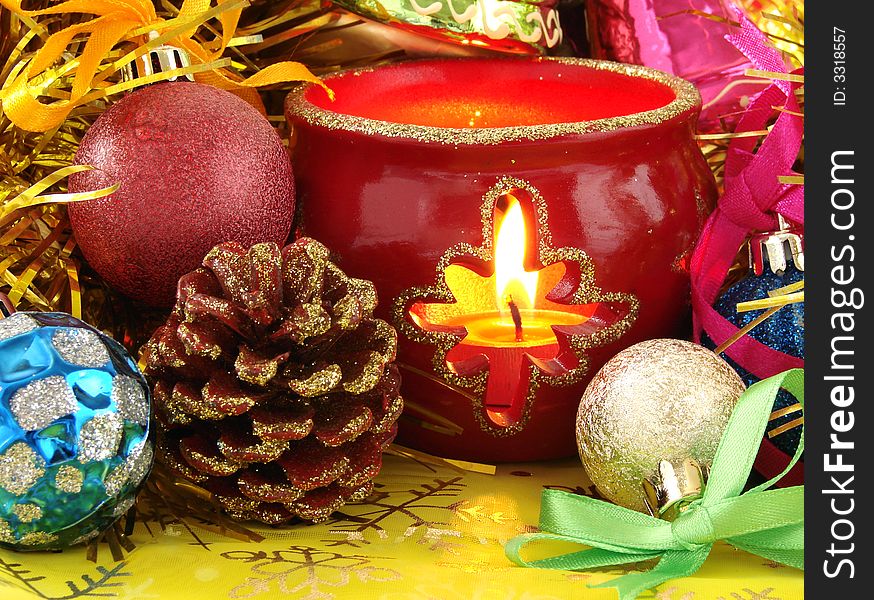 Colorful christmas decorations with burning candle. Colorful christmas decorations with burning candle