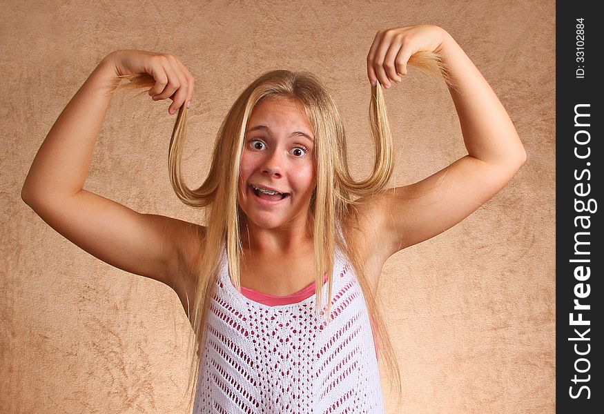 Young Girl Holding Hair