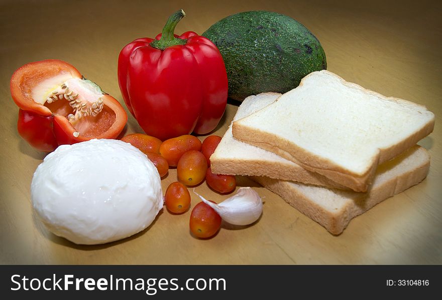 Fresh sandvich ingredients on a cutting board