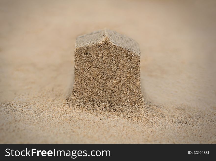 House&#x28;home&#x29; structure made in beach sand - concept photo.