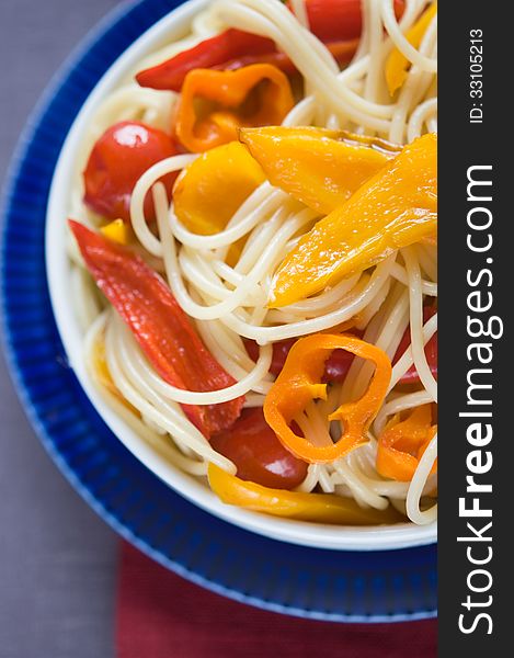 Pasta with colorful vegetables close up