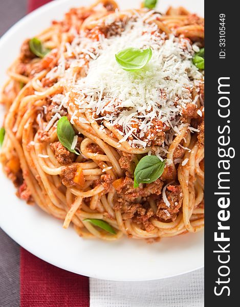 Spaghetti bolognese with parmesan and basil