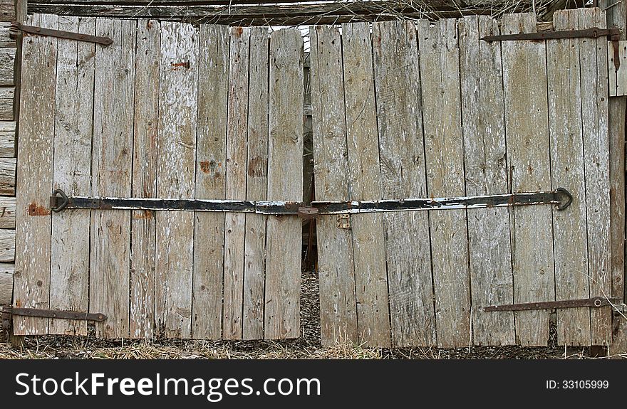 Old barn wooden gates closeup. Old barn wooden gates closeup