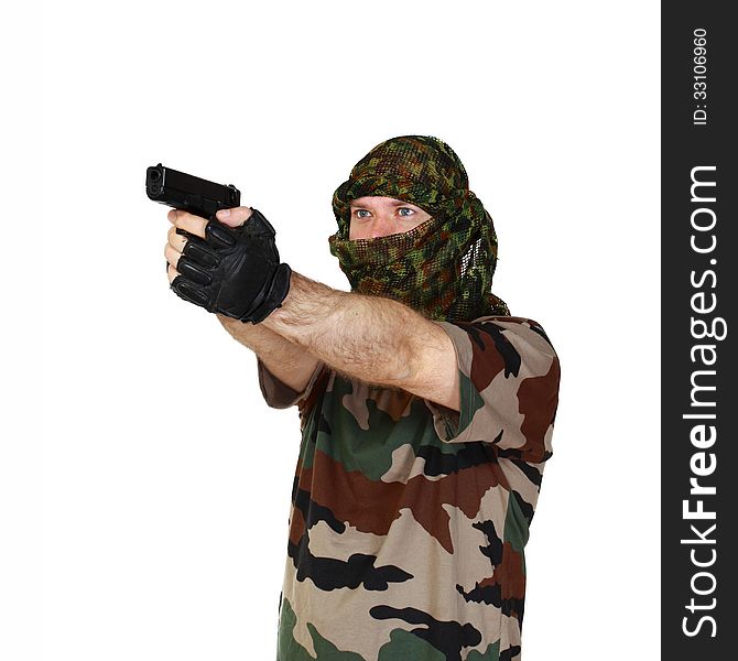 Man in camouflage aiming a gun. Isolated on white background. Man in camouflage aiming a gun. Isolated on white background