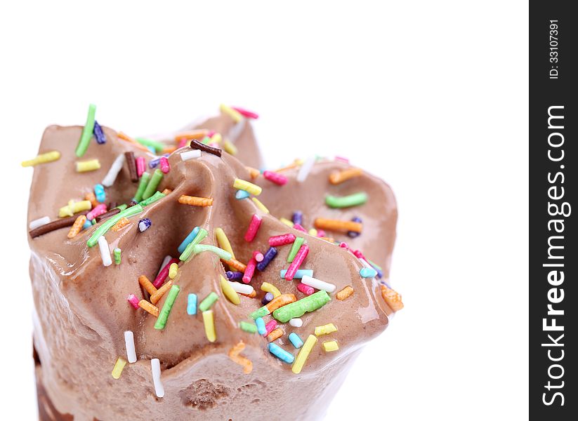 Close up image of chocolate ice cream cone. Sprinkles.
