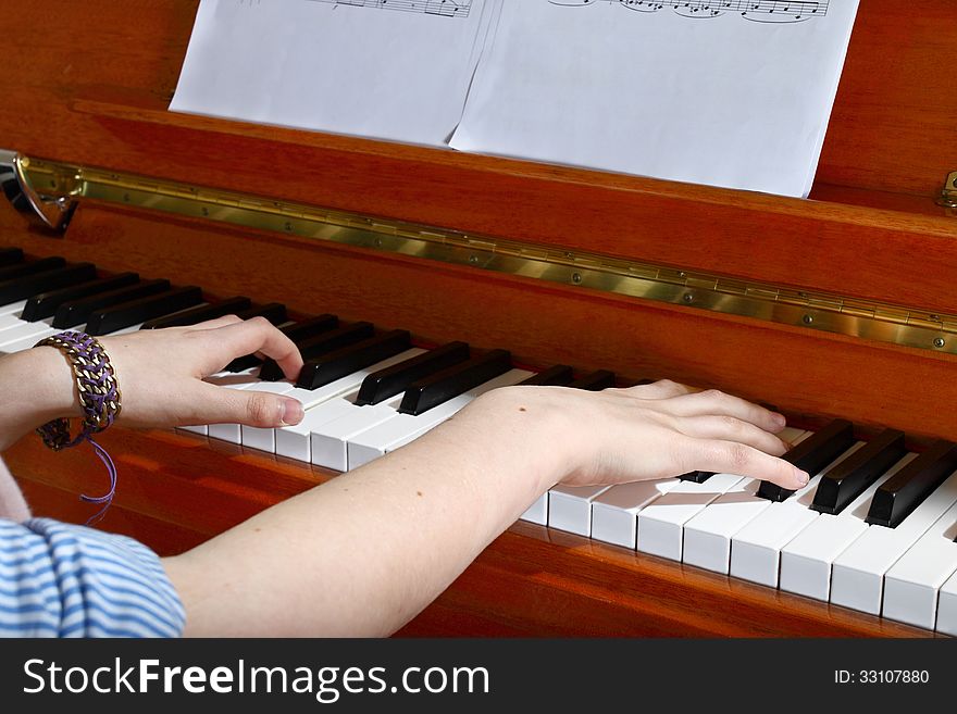 Closeup of hands playing the piano. Closeup of hands playing the piano