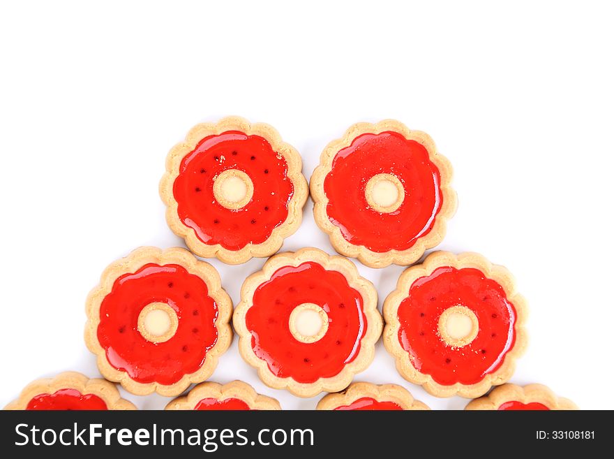 Five rings of strawberry biscuits. White background.