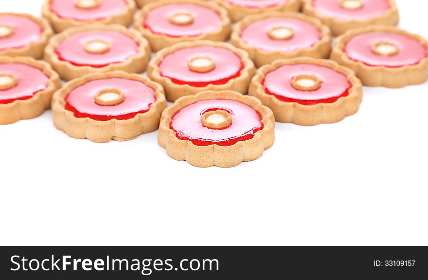 Lot of strawberry biscuits are located top background. Lot of strawberry biscuits are located top background.