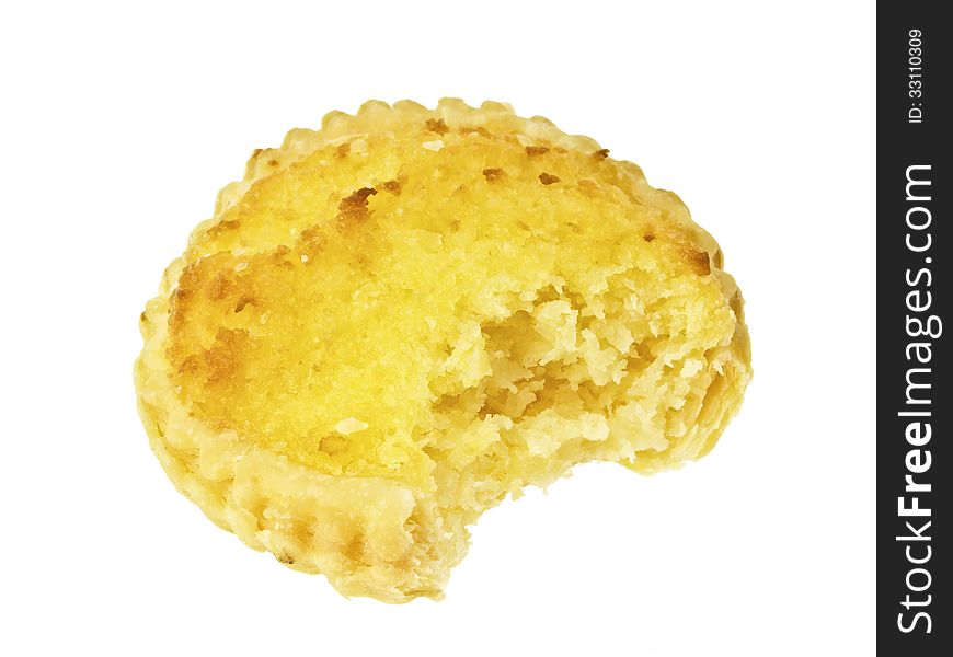 Bite marks on a piece of coconut pie on white background. Bite marks on a piece of coconut pie on white background