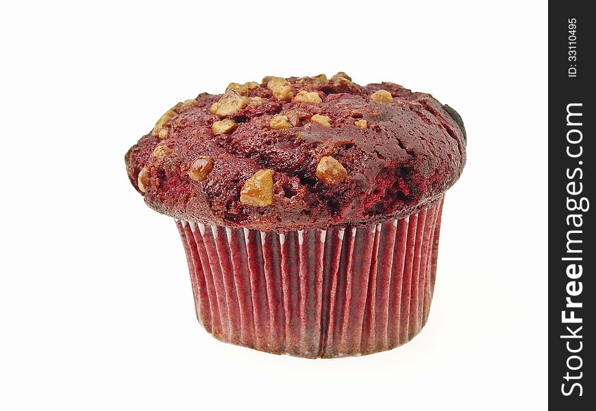 Red almond muffin cake in paper cup on white background. Red almond muffin cake in paper cup on white background