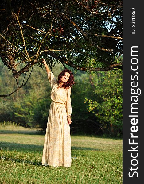 Portrait of the beautiful woman in the forest. Shooting on the nature. Portrait of the beautiful woman in the forest. Shooting on the nature.