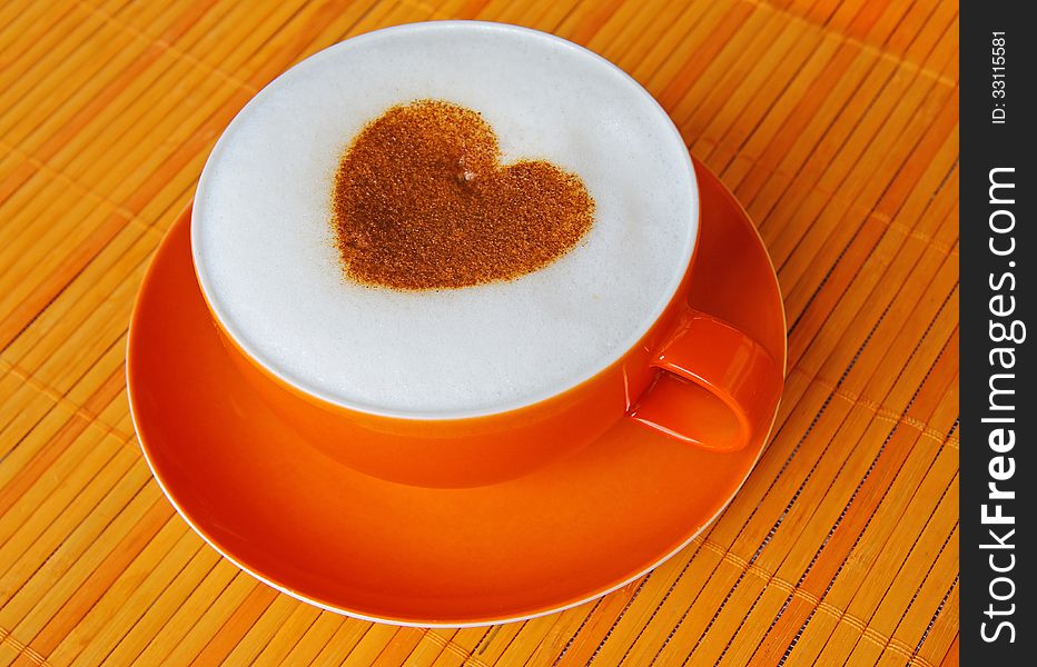 Cappuccino with heart ornament made of cinnamon. Cappuccino with heart ornament made of cinnamon