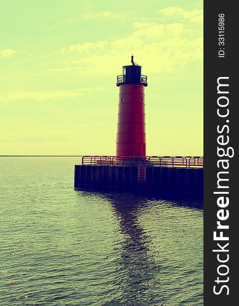 Red lighthouse on Lake Michigan