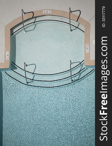 Vertical photograph of a swimming pool from overhead viewpoint