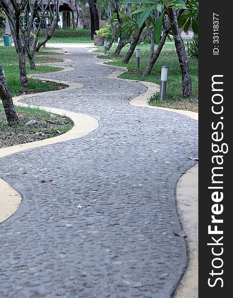 Curved Rock Road resort walk way green tree