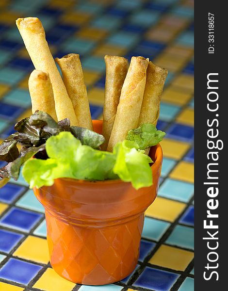 Deep Fried shrimp rolls on the mosaic colorful table