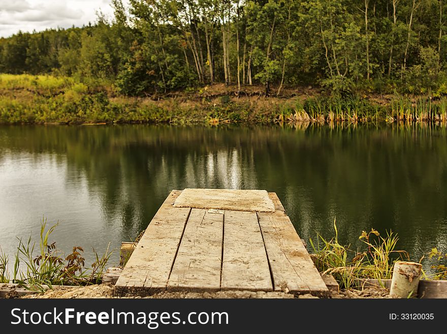 Diving board wood planks pool swimming pond countryside trees homemade inventive. Diving board wood planks pool swimming pond countryside trees homemade inventive