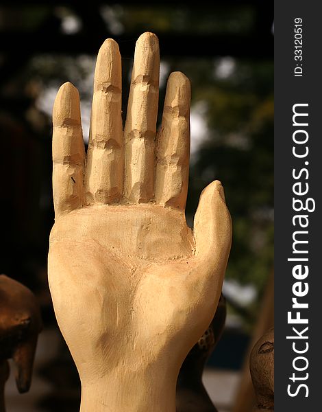 African carved hand indicating STOP, warning or - to some cultures - greeting. African carved hand indicating STOP, warning or - to some cultures - greeting.