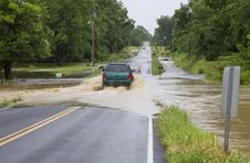 An SUV Driving On Flooded Road Royalty Free Stock Image An SUV Driving On Flooded Road Royalty Free Stock Image