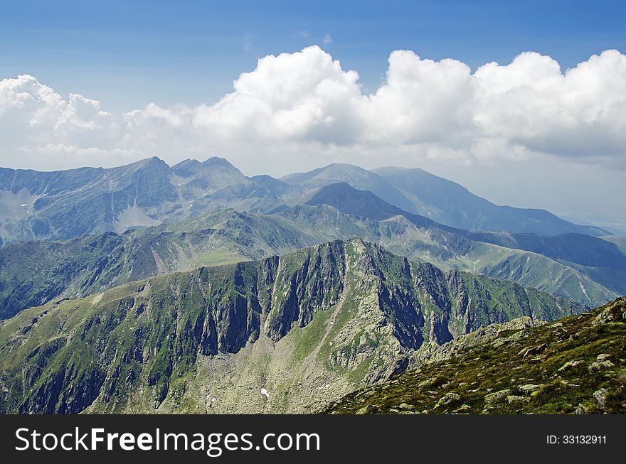 Over the clouds - view from Mount Negoiu, Fagaras Mouintains, second highest peak in Romania. Over the clouds - view from Mount Negoiu, Fagaras Mouintains, second highest peak in Romania.