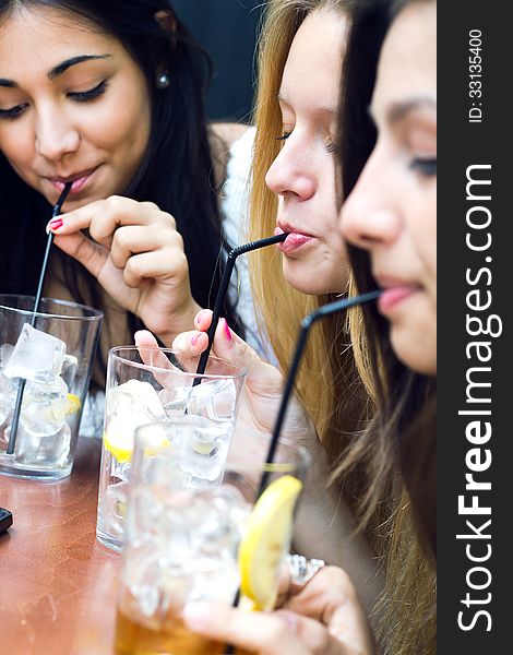 Friends Taking A Drink On A Terrace