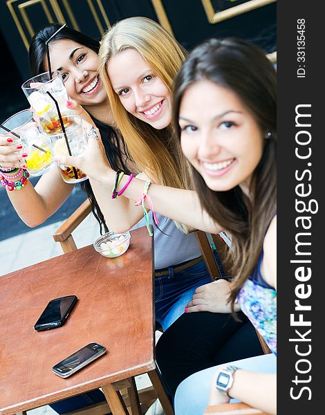 A group of friends taking a drink on a terrace