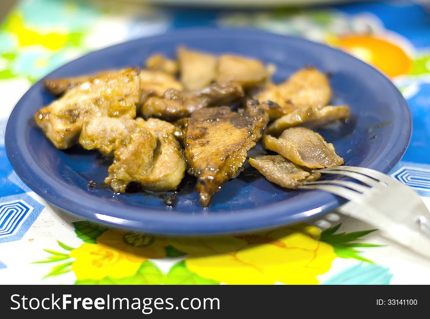 Pork fries on blue dish