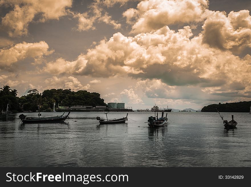 Many fishing boat on the sea with cloudy sky in the evening